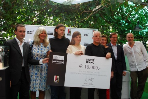 Gisele Vienne holds her award