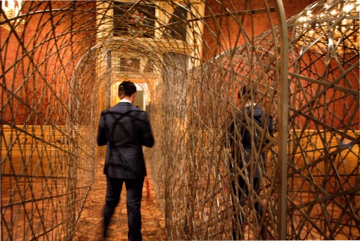 A visitor is going through Eliasson's "Fivefold Tunnel" (2000)